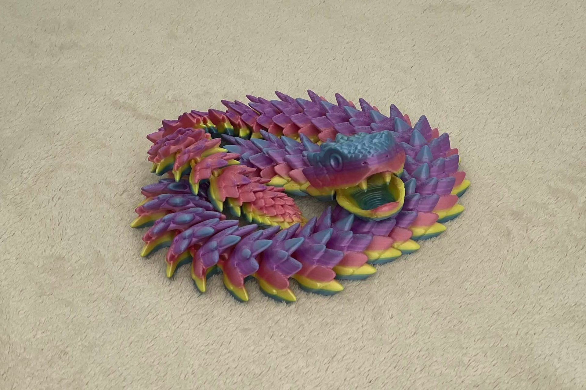 Articulated snake with movable jaw