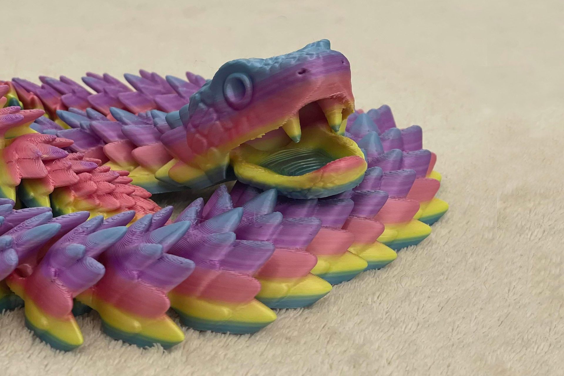 Articulated snake with movable jaw