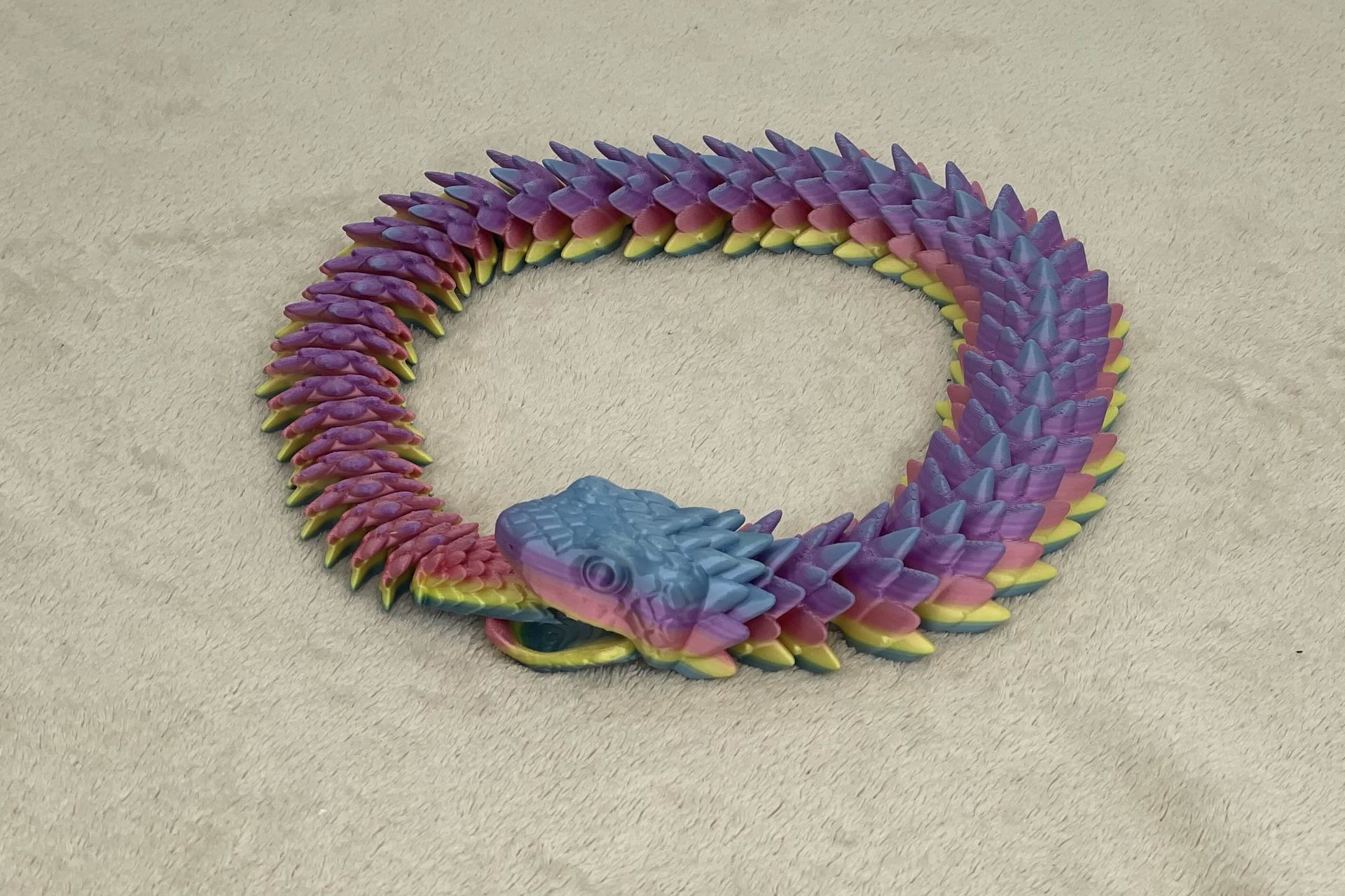 Articulated snake with movable jaw
