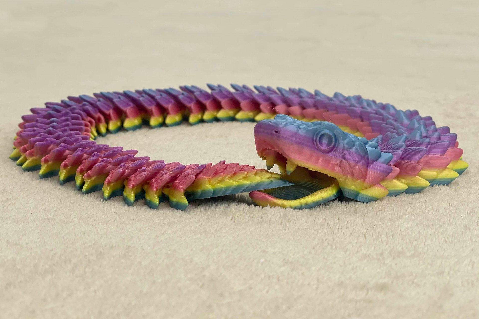 Articulated snake with movable jaw